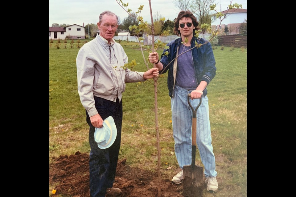 BarrieToday writer Ian McInroy and his father, Alex, celebrate a tree-planting in 1988. Alex died in August 2005. 