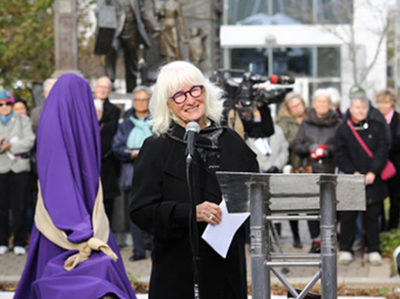 Hillsdale artist Marlene Hilton Moore is shown at a public unveiling. 