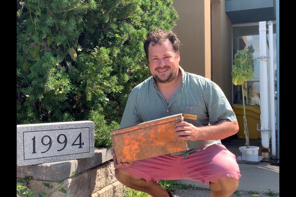 Brian Shelley, vice president of philanthropy, brand and community development for the YMCA of Simcoe/Muskoka, is excited to see what is inside of a time capsule located behind the 1994 cornerstone of the former Barrie YMCA.
