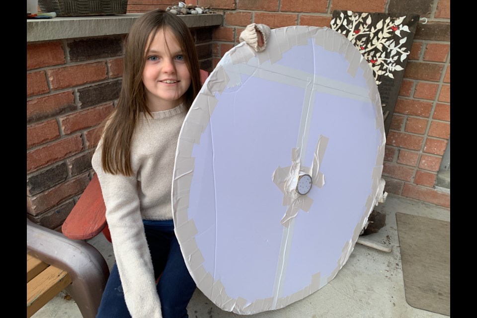 Nine-year-old Katie Howlett, seen here with a prototype of her latest invention called Musical Squares, took top spot in the junior category for most innovative toy or game as part of the People of Play Young Inventor Challenge, during the Chicago Toy and Game Fair.