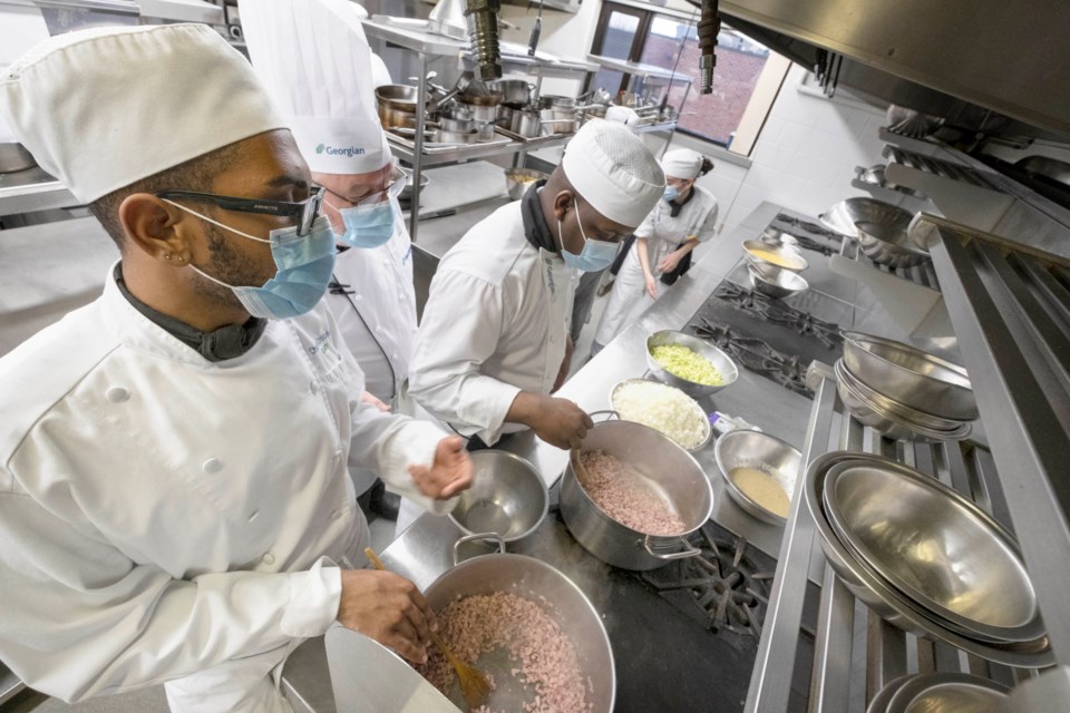 Close to 40 second-year culinary students were busy prepping in the labs at the Barrie Campus last week preparing a special holiday lunch – turkey with all the fixings – to 200 clients of the David Busby Centre. The meals were delivered on Dec. 17.