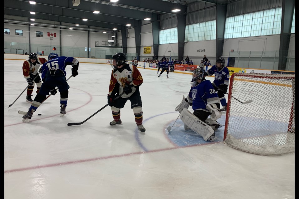 The Mariposa U15 OMHA team takes on the Douro Dukes Optimist Club U15 as they begin their fight for the coveted Red Hats Saturday afternoon at the OMHA championship tournament at the East Bayfield Community Centre in Barrie.