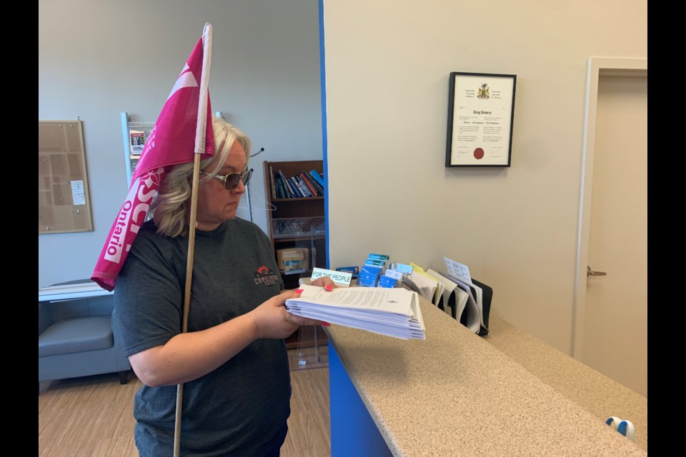 Misty Archer, president CUPE Local 1310, which represents local custodial and maintenance members, delivered hundreds of letters to Barrie-Springwater-Oro Medonte MPP Doug Downey's Barrie office on June 23, 2022. 