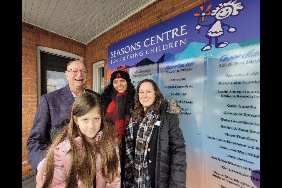 Clockwise from top left are Seasons Centre for Grieving Children managing director Rowley Ramey, grief ambassador Nina Purewal, development director Lisa Spinks, and Sophie-Claire. They are shown at the unveiling of the new wall thanking the community for 27 years of help during a special ceremony on Friday. 