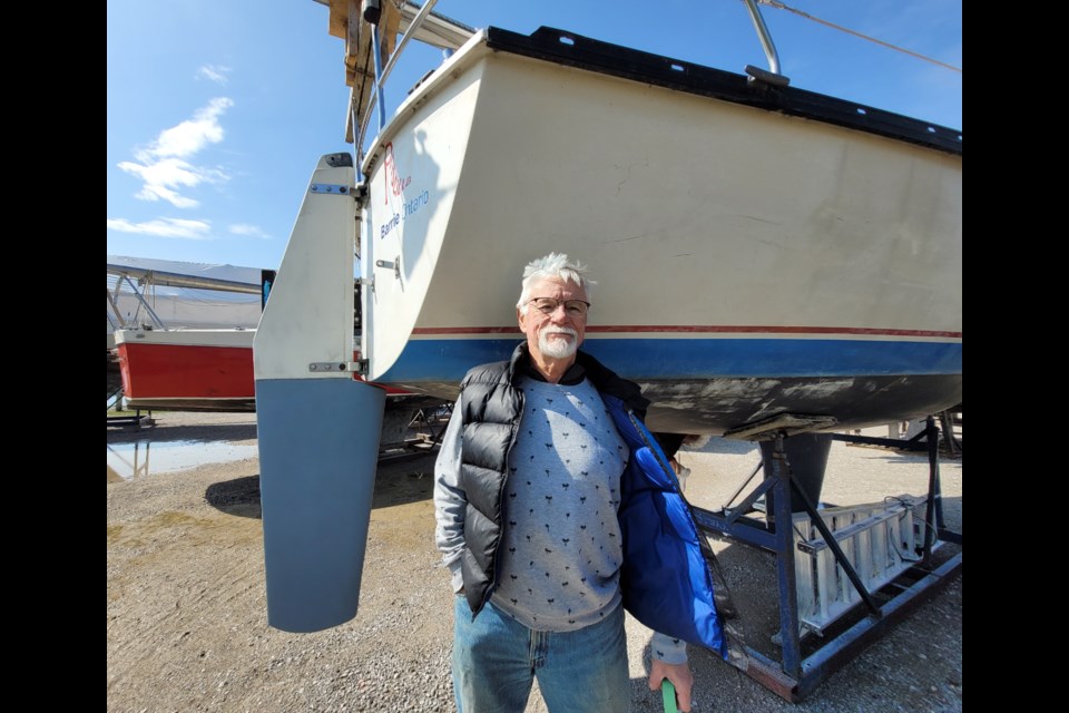 Boater and city marina user Greg Moore stands beside his boat Priscilla, on Thursday, April 20.