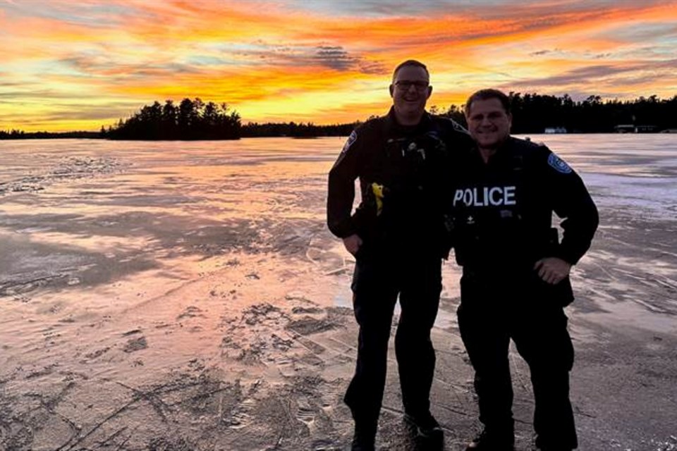 Barrie police Const. Guy Peters, left, shown is with a member of the Treaty 3 Police Service.