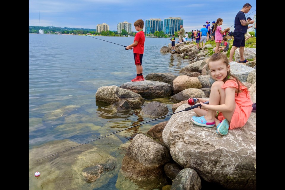 Alana Hickey, 7, fishes at Sunday's Kids Fishing Day in Barrie.