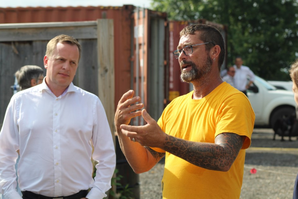 Innisfil Creek Honey owner Brian Scott explains his operation to a group of politicians, including Environment Minister Jeff Yurek, during an announcement on Wednesday, Aug. 6, 2019. Raymond Bowe/BarrieToday