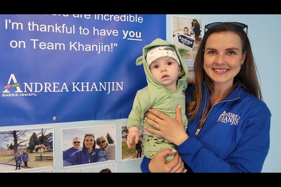 Andrea Khanjin, shown with her young son in a recent file photo, is heading back to Queen's Park for a second term following Thursday's provincial election. 