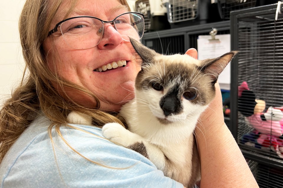Staff member Susan Bartley shows off a young rescue during the open house at Furry Friends Animal Shelter on Hart Drive in Barrie.
