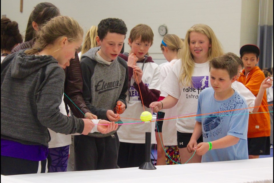 Students from Codrington and Warnica elementary schools in Barrie work together to complete an activity at the Raise the Bar conference. 
Robin MacLennan/BarrieToday
Robin MacLennan/BarrieToday