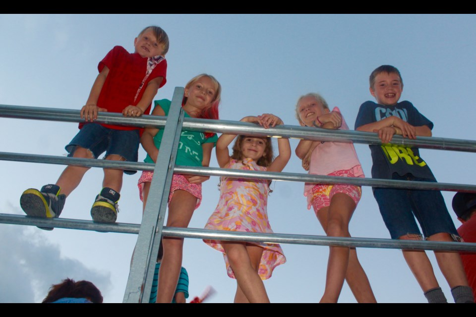 A group of young friends enjoy a break in the action at the Demolition Derby on Thursday evening.
Robin MacLennan/BarrieToday