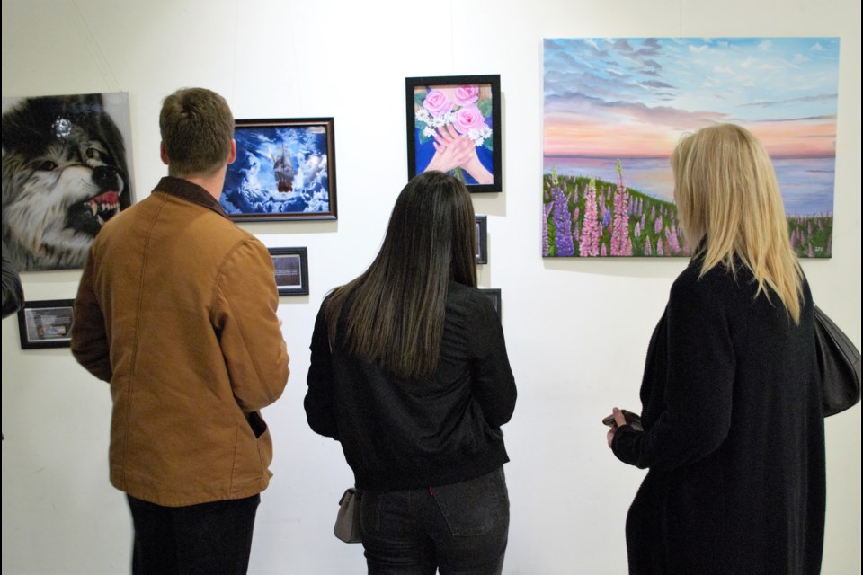 Patrons viewed the art on display at the opening reception for The Steel Spirit, a special art exhibit running at the Barrie city hall rotunda for the month of October. Jessica Owen/BarrieToday