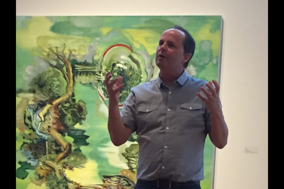 Artist Gary Evans, who is also a professor at Georgian College, gives an animated chat about his large and colourful oil paintings.  Sue Sgambati/BarrieToday
