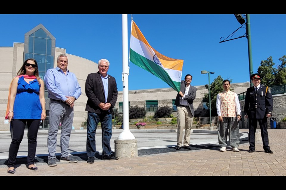 Left to right: MPP Andrea Khanjin, MP Doug Shipley, MP John Brassard, Mayor Jeff Lehman, Barrie Indian Association president Shakir Barmare and Barrie police deputy chief Rich Johnston get ready to raise India's flag at City Hall on Sunday, Aug. 15, 2021.