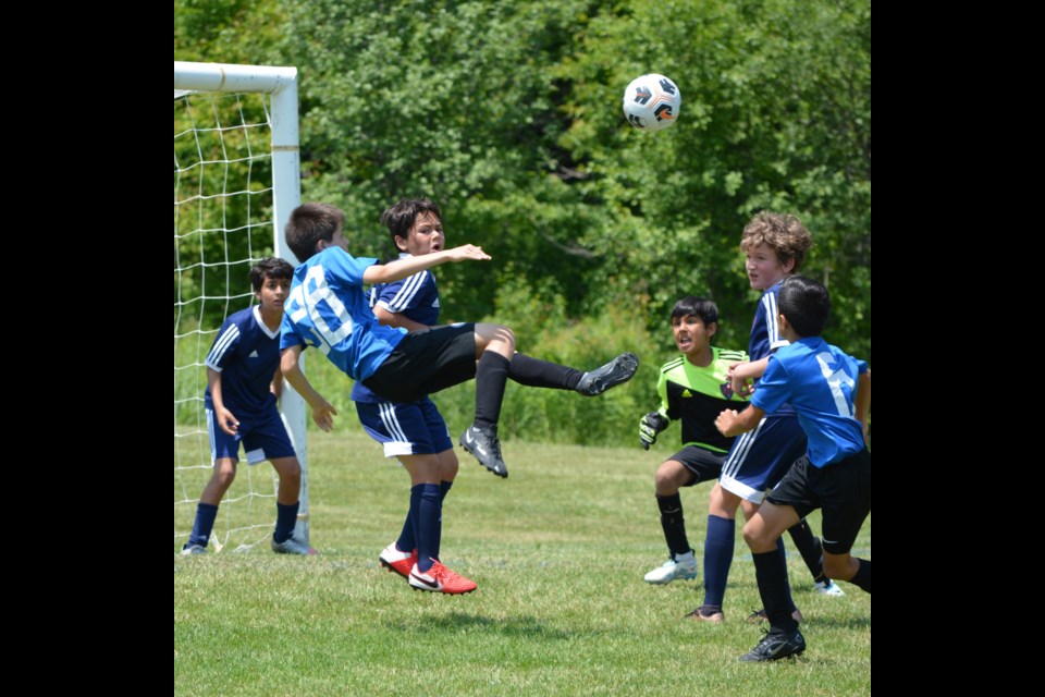 Benson Maduro takes flight and shows off his footy skills.