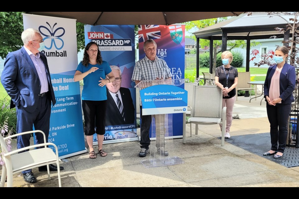 The provincial and federal government joined forces to make a $3.1-million funding announcement Tuesday at the Bob Rumball Home for the Deaf. From left to right: Barrie-Innisfil MP John Brassard, interpreter Amy Skidmore, Derek Rumball, administrator Shirley Cassel and Barrie-Innisfil MPP Andrea Khanjin.