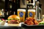 symposium restaurant in barrie serving beer, wings, burgers for lunch and dinner food
