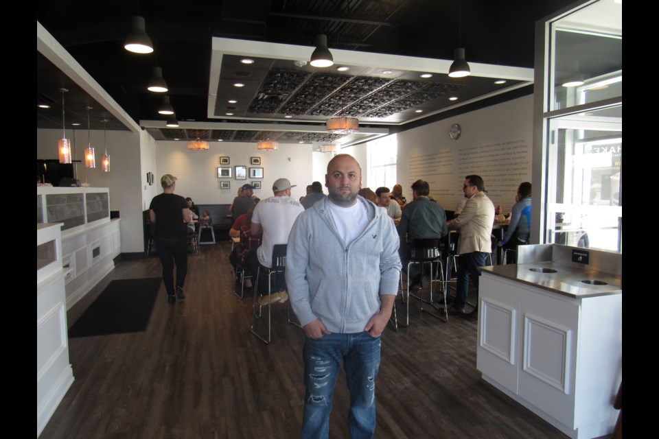 Shant Mardirosian recently opened The Burger's Priest in Barrie. Photo by Shawn Gibson for BarrieToday.                               