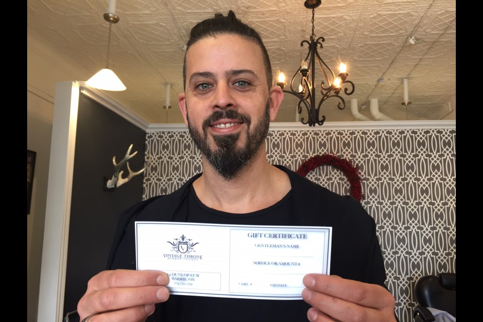 Hot towel shave for $25: Vintage Throne owner Daniel DiTommaso holds up a gift certificate for services at his shop located at 64 Dunlop Street East.
Sue Sgambati/BarrieToday