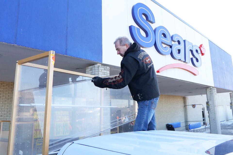 Flavio Ragazzon of Glencairn loads display cabinets onto his truck after buying them from the Sears store at Georgian Mall on Saturday, Jan. 13, 2018. It is the final weekend before the store closes its doors for good. Kevin Lamb for BarrieToday.