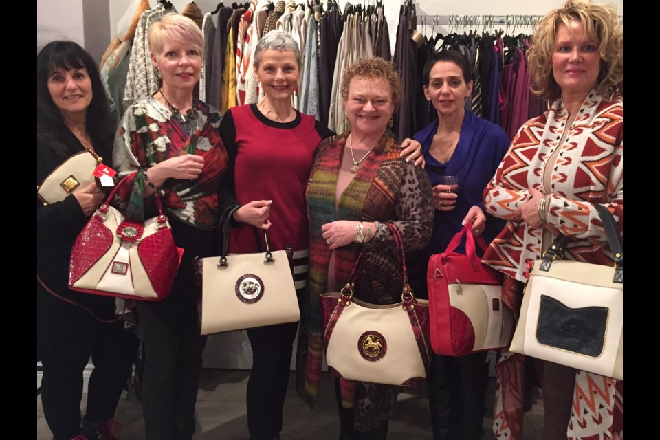 Zu Zu Fashion Boutique owner Tracey Baker (3rd from left) poses with happy customers and sales staff.  Sue Sgambati/BarrieToday
