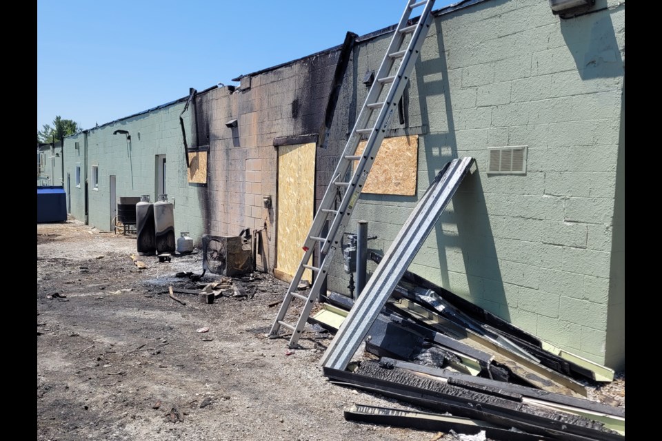 The back of the Street Cats Rescue building in Oro-Medonte Township had been boarded up on Monday after a fire caused significant damage.