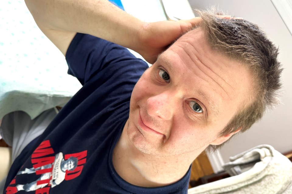 Jason Helmond shows off his hair which will be shaved off during his sixth annual Razors of Hope event in support of Terry Fox Foundation on May 25 at Barrie police headquarters on Fairview Road.