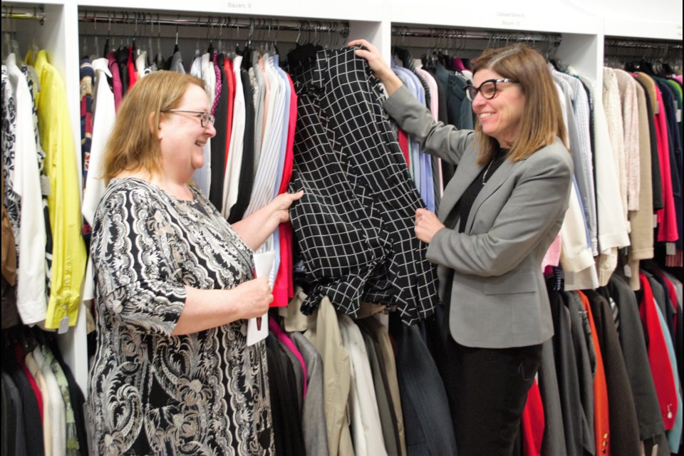 Linda Reid, executive director for Dress for Success Orillia and Barrie, gives a tour of the Barrie facility to the Honourable Filomena Tassi, Minister of Seniors. Jessica Owen/BarrieToday