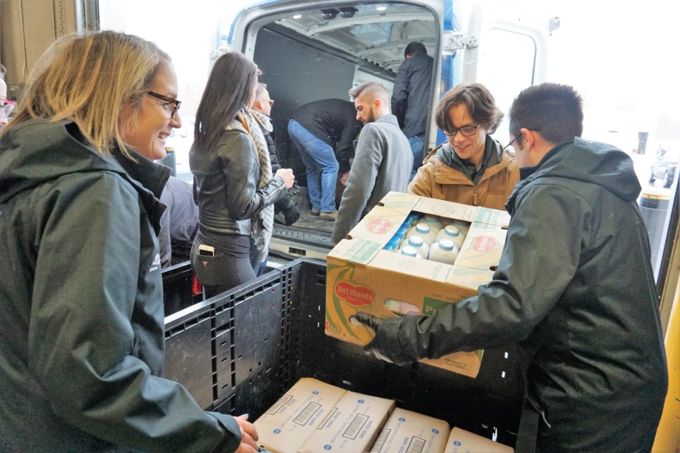 Employees of Barrie Ford, Barrie Chrysler and 400 Chrysler unload food donations at the Barrie Food Bank on Tuesday. Jessica Owen/BarrieToday         