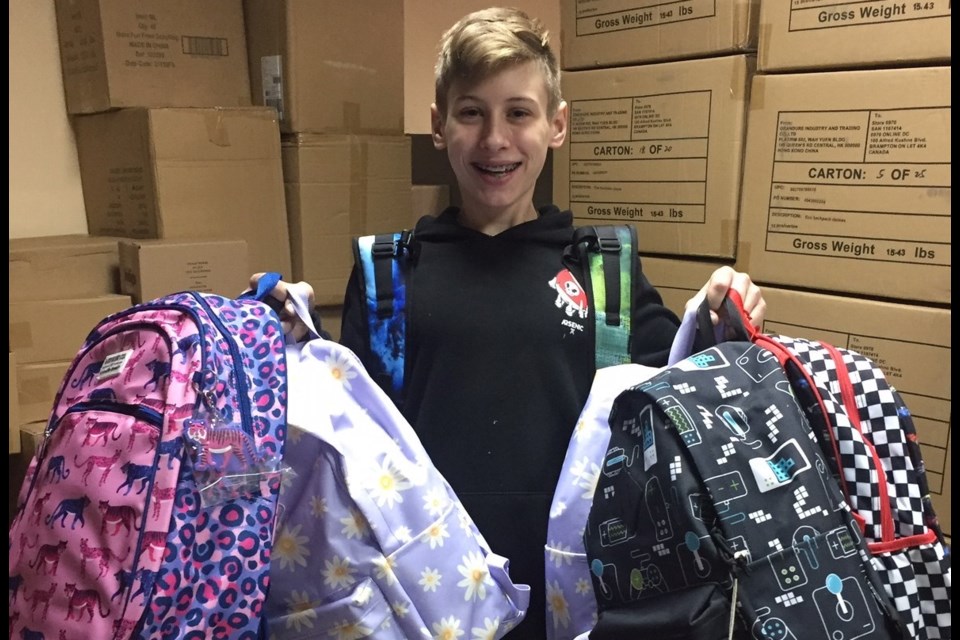 Oscar Oliver is shown with backpacks in Poland.
