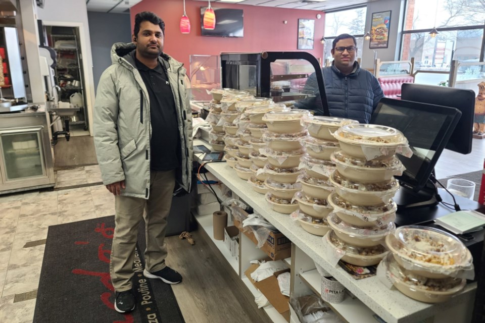 Members of the Ahmadiyya Muslim Youth Association delivered warm festive meals to the less fortunate on Christmas Day.