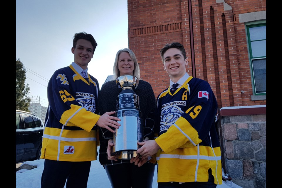 Before last year's game, Nicholas Dowlings (left), CMHA's Liz Grummett and Cole Quevillon were on hand with the Start Talking Cup. Shawn Gibson/BarrieToday