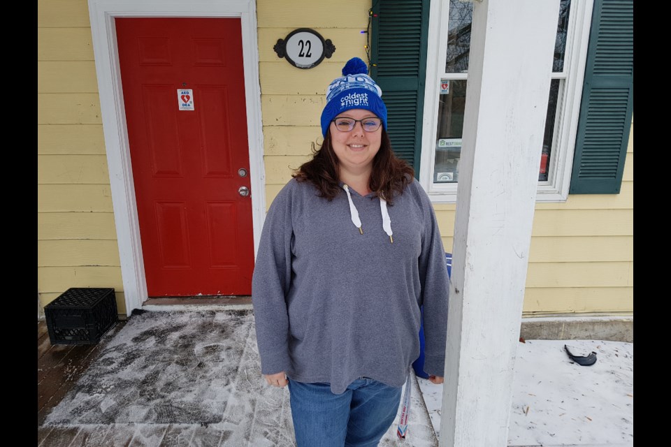 Nicole Barkley wears the CNOY toque outside Barrie's Youth Haven. Shawn Gibson/BarrieToday