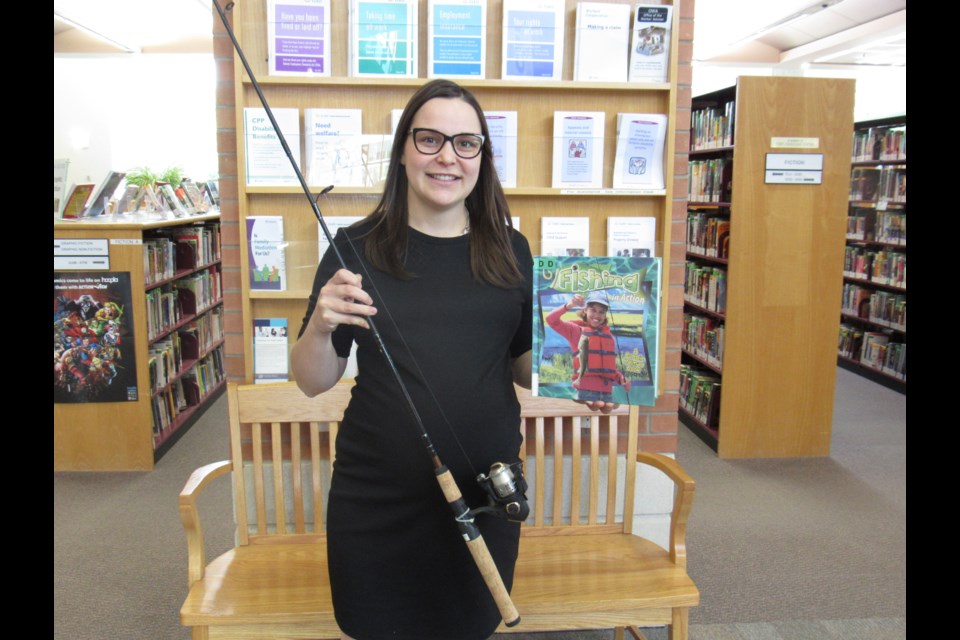 Katelyn Lees, Associate Manager and Philanthropy/Community Engagement Director for the Barrie Public Library is no stranger to the sport of fishing. Photo by Shawn Gibson for BarrieToday.
