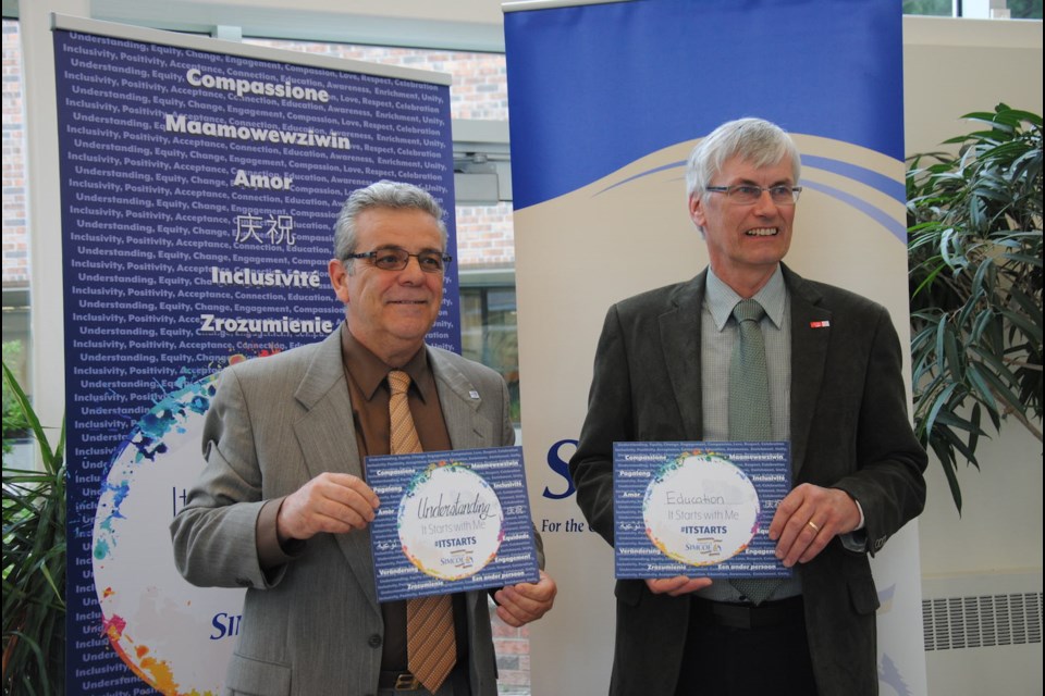 Bradford's politicians are in on the anti-racism campaign. Here, deputy mayor James Leduc and mayor Rob Keffer take the pledge. Laurie Watt for BarrieToday