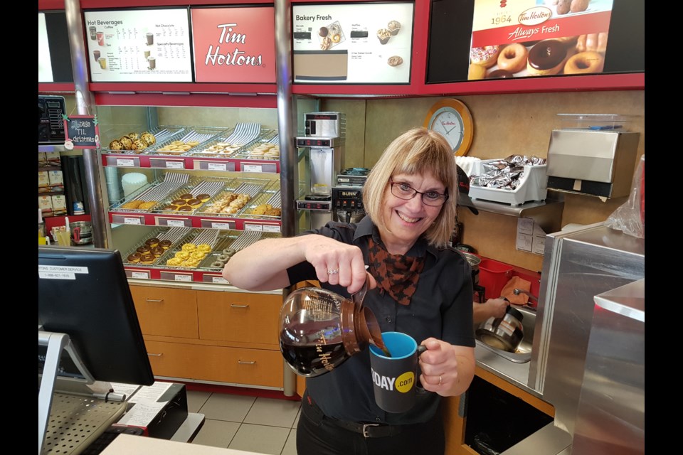 Marlene Drysdale pours a cup of coffee in her new BarrieToday mug with her famous welcoming smile. Shawn Gibson/BarrieToday