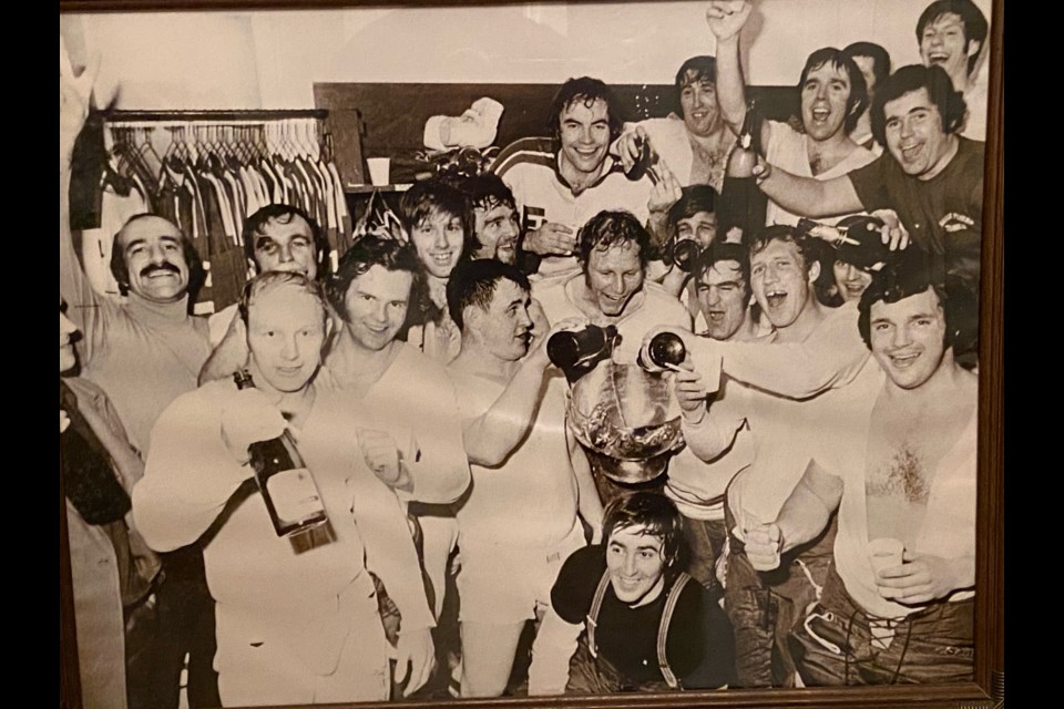 The Barrie Flyers celebrate their 1974 Allan Cup triumph in their dressing room in Cranbrook, B.C.