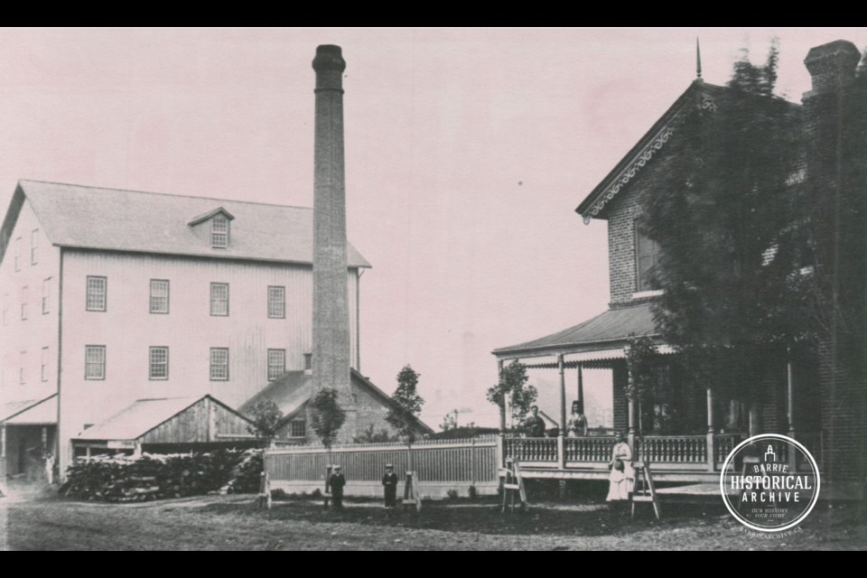 The large white building, Wilkinson's Mill, shown in 1870, stood on Maple Avenue approximately where the bus terminal is located today.