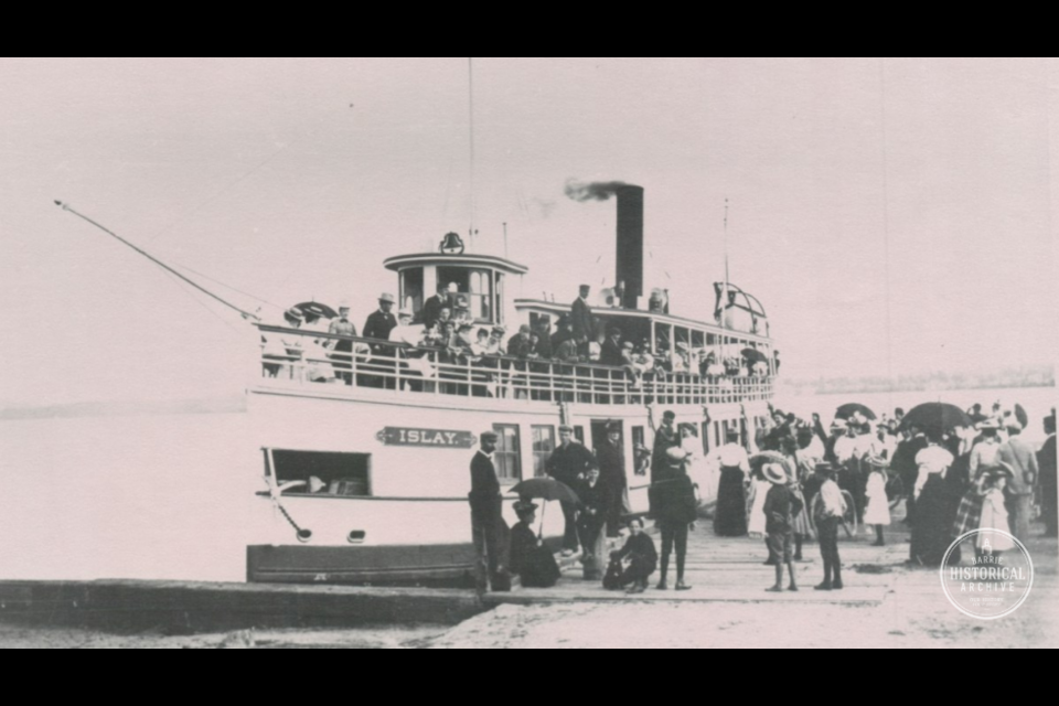 The Islay taking on passengers at the government dock in Barrie circa 1900.