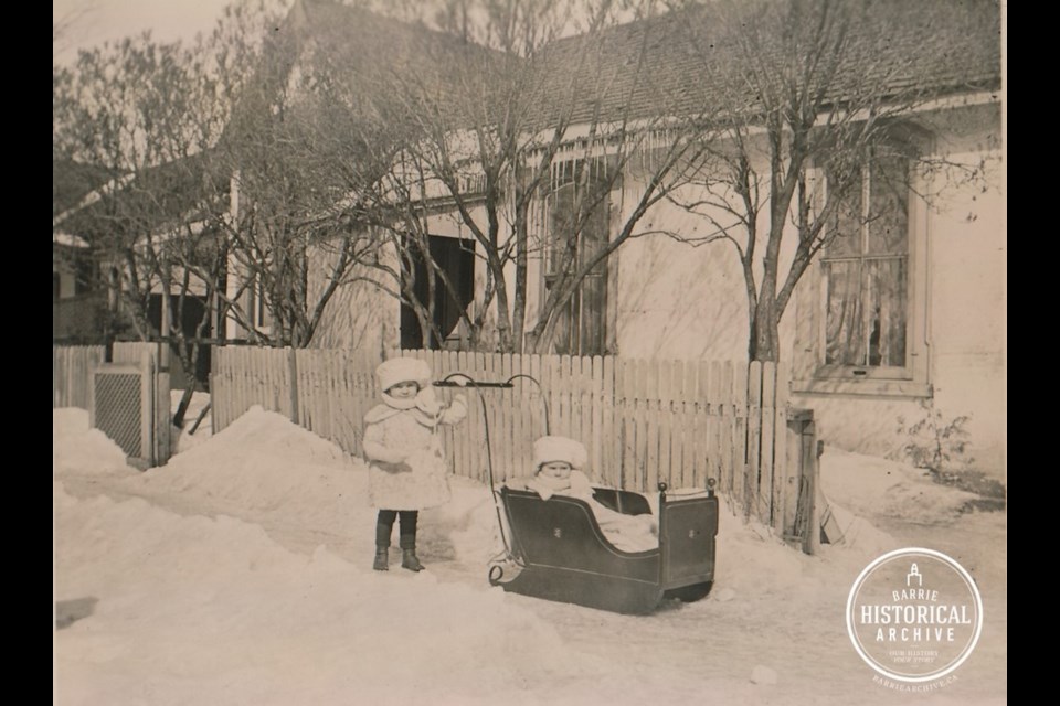 The McCutcheon sisters enjoy the outdoors on a winter day in front of their Florence Street home circa 1916. Photo courtesy of the Barrie Historical Archive