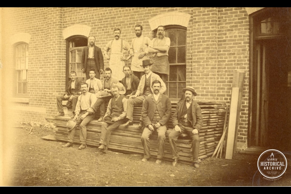 Workers sitting in front of Ball Planing Mill. circa 1890. Photo courtesy of the Barrie Historical Archive. 