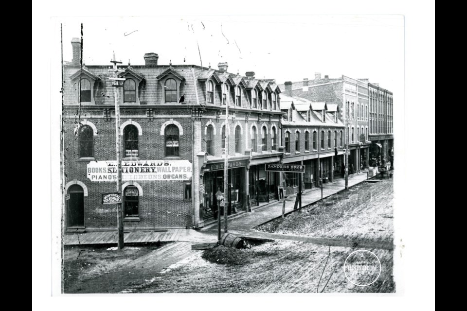The first Sanders Brothers shop location, rebuilt after an 1871 fire, on the south side of Dunlop Street near present day Meridian Place. An early office of Dr. McConkey was located above the store. Photo courtesy of the Barrie Historical Archive