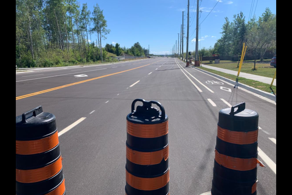 Work is in its final stages Wednesday morning on the Harvie Road-Big Bay Point Road bridge over Highway 400 in Barrie. 