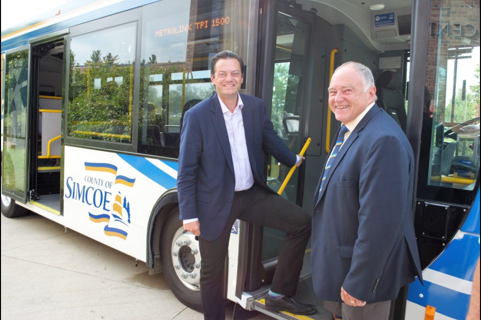 Barrie Mayor Jeff Lehman and County of Simcoe Warden George Cornell step onboard a LINX bus during an event celebrating the newest LINX transit routes at the County of Simcoe administration building on Aug. 13, 2019. Jessica Owen/BarrieToday