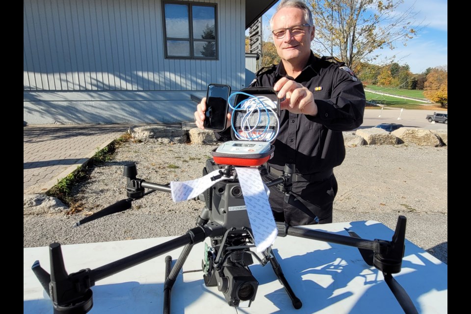 County of Simcoe Paramedics Chief Andrew Robert poses with the Matrice 300 drone used in a mock life-saving demonstration on Thursday at Horseshoe Resort in Oro-Medonte Township.