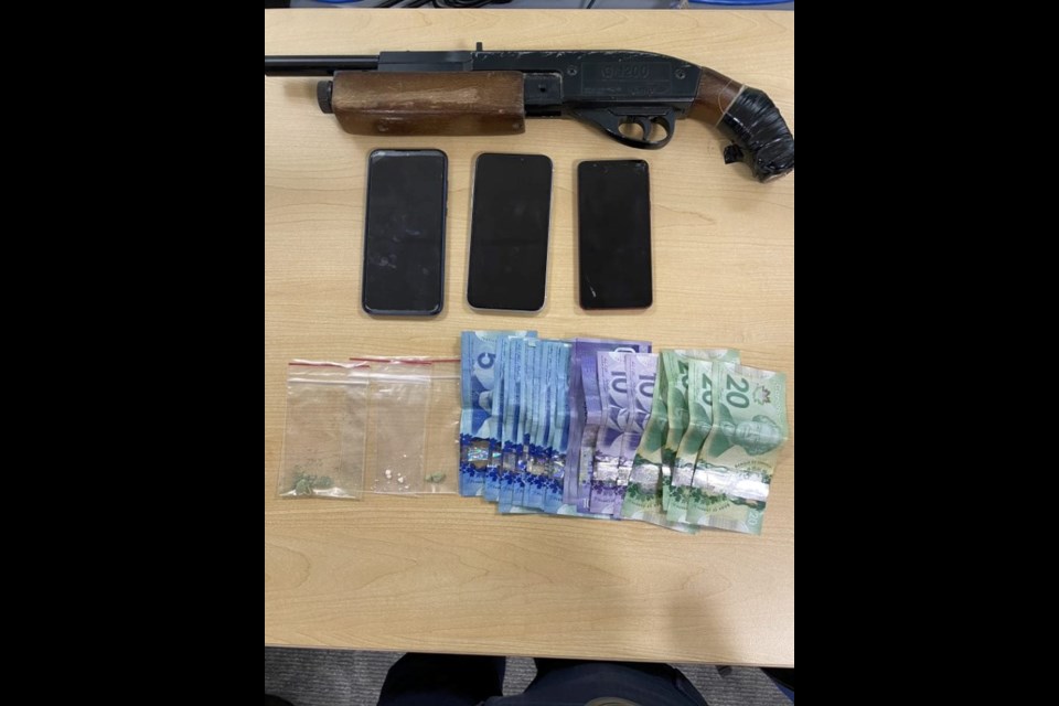 A sawed off pump action pellet gun, money, fentanyl and cocaine were found on two males wanted for an assault earlier this year.