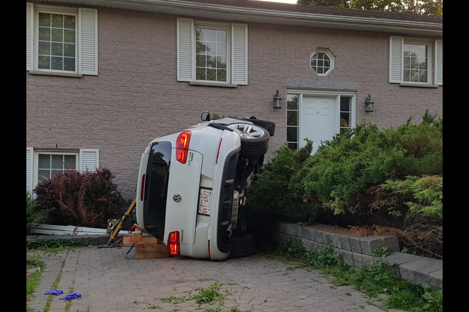 A vehicle rests in front of this Drury Lane home near downtown Barrie after city police say the driver fled two collisions on Tuesday, July 23, 2019. Shawn Gibson/BarrieToday