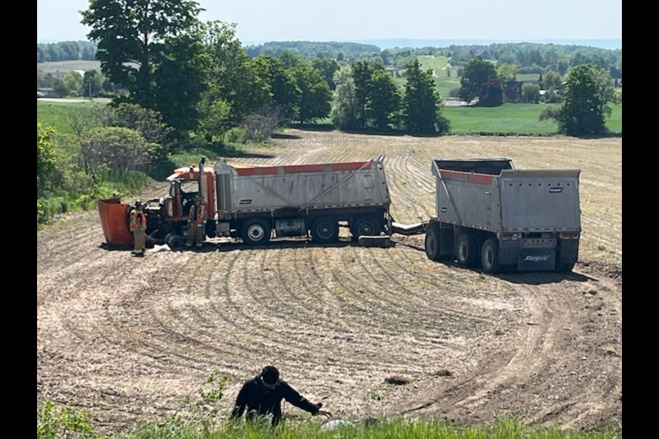 This dump truck ended up in a field following a collision Tuesday at Highway 27 and Mapleview Drive.