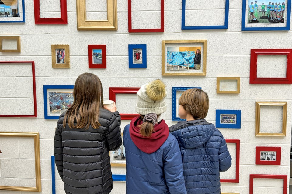 Visitors check out artwork at the grand opening of Maple Ridge Secondary School on Prince William Way in southeast Barrie on Tuesday, Nov 21, 2023.